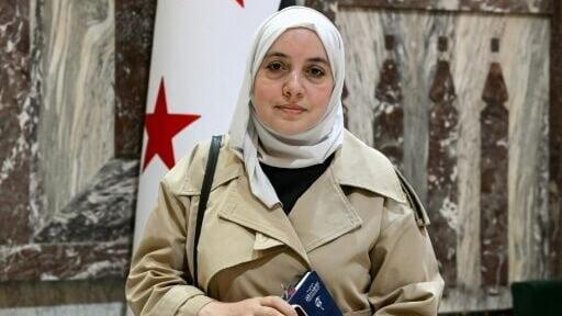 Syria's member of parliament Nour Jandali poses inside one of the halls of the parliament in Damascus on July 27, 2026