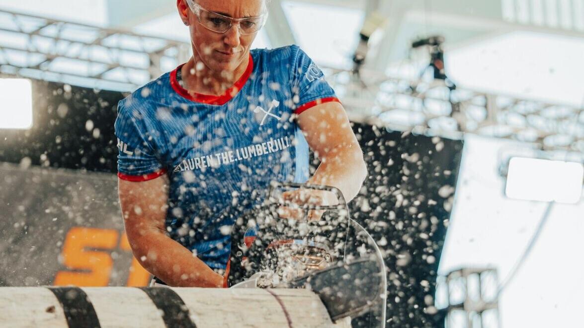 Lauren Bergman, the inaugural STIHL TIMBERSPORTS® North American Women's Cup champion, competes in the Stock Saw discipline during competition.