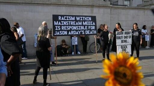 Supporters at a vigil for Jason Arday