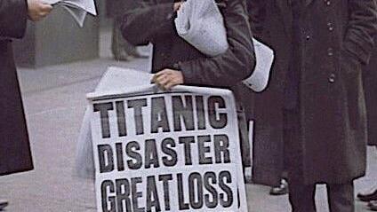 A paperboy sells newspapers announcing the demise of the RMS Titanic.