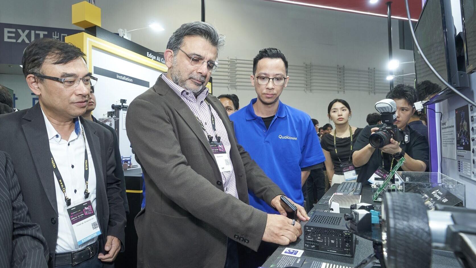Nakul Duggal, Executive Vice President at Qualcomm, greets Randy Chien, Chairman of Innodisk at Innodisk booth during Computex 2026