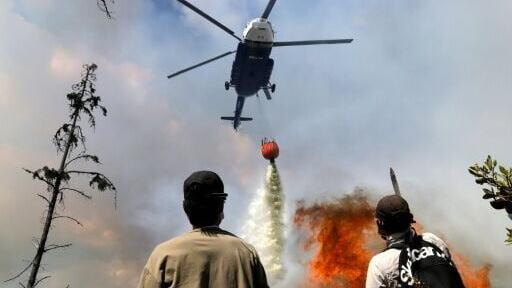 Two helicopters from the governor's office and two military helicopters joined the effort
