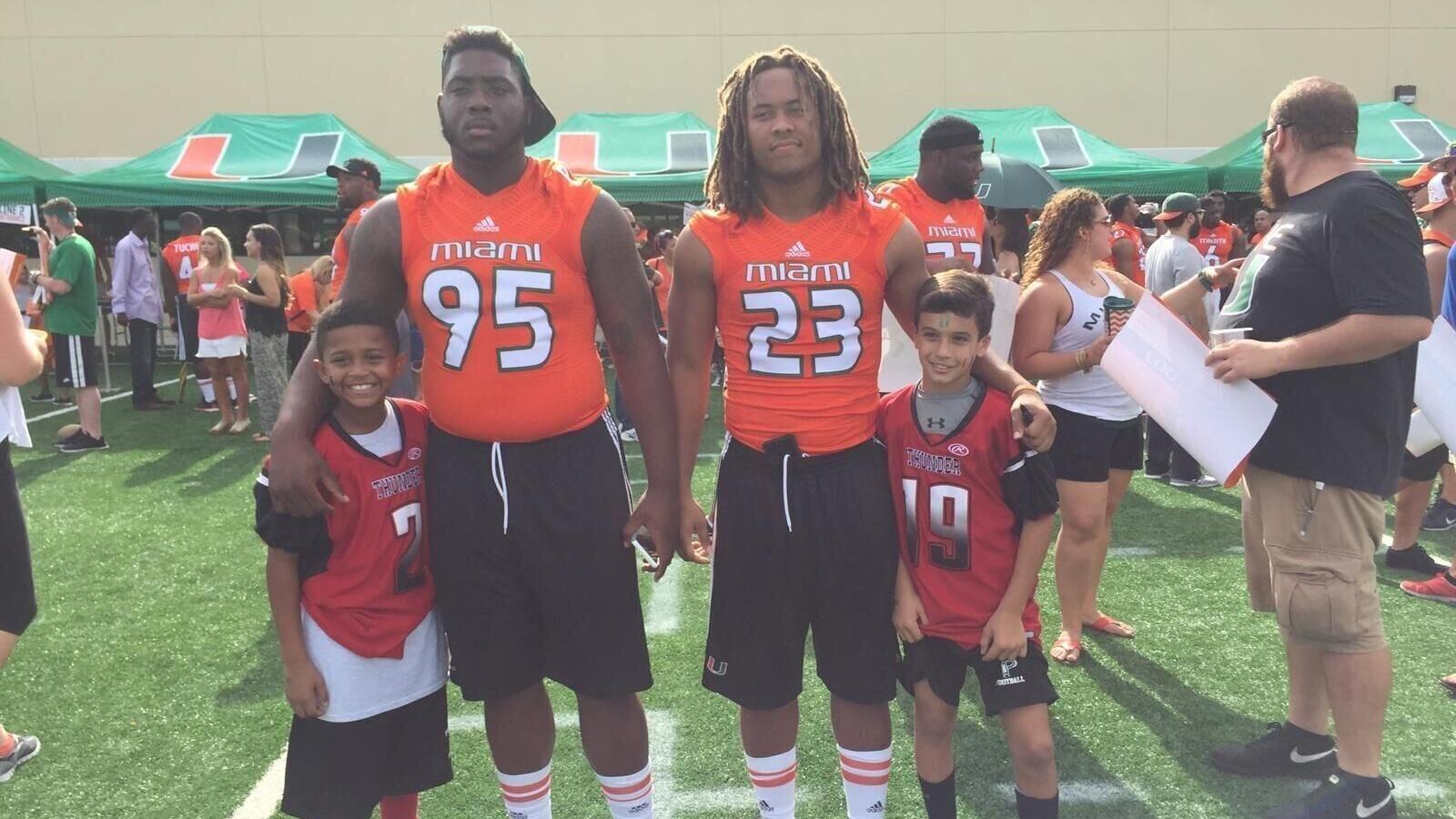 Nick Rodriguez stands with Miami players