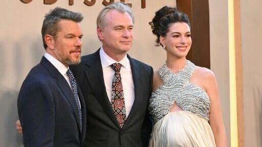 British-US director Christopher Nolan is flanked by Matt Damon, who plays Odysseus and Anne Hathaway, who plays Penelope, at the premiere of "The Odyssey" in New York