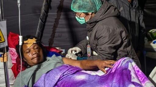 Patients at Ruteng hospital were moved outdoors after a 7.7-magnitude quake struck Flores island