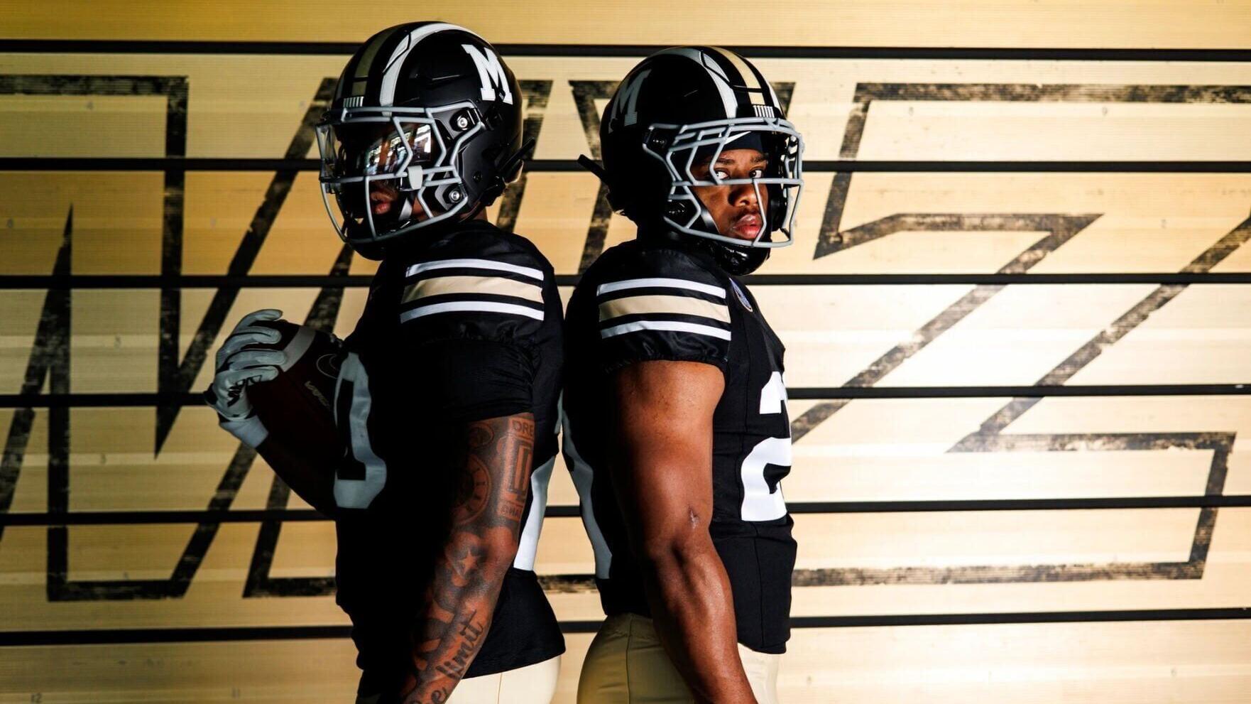 A pair of Mizzou football players model