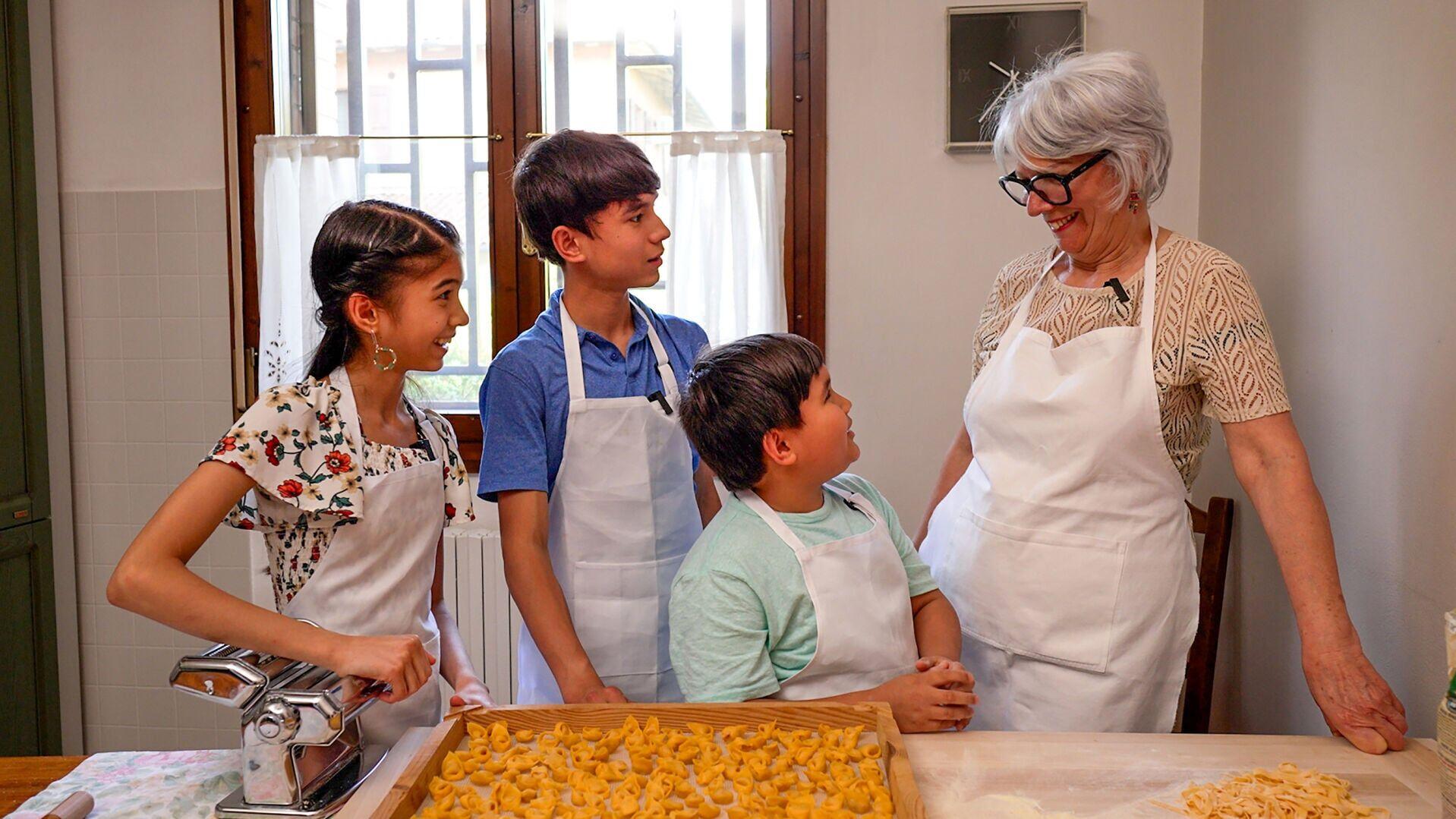 The young hosts of Fork in the Road learn the art of tortellini from Nonna Clara in Bologna, Italy - one of the hands-on culinary adventures woven throughout the series, now streaming on EWTN+