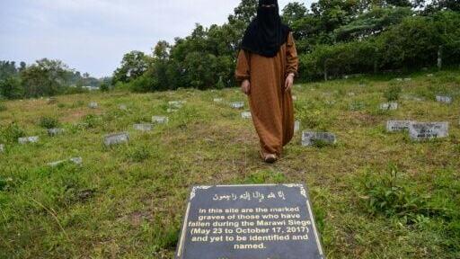 Sophia Aminolla does not know if her younger brother Amerel is among those lying beneath the numbered graves in Marawi