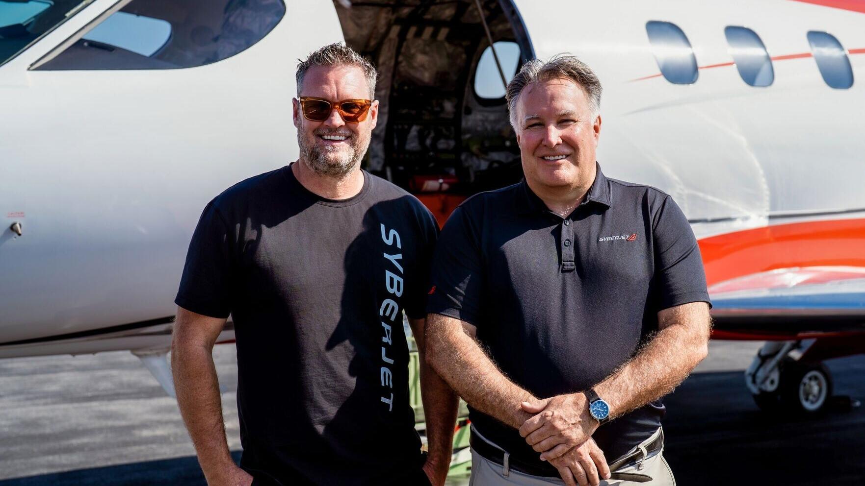 SyberJet CEO Trevor Milton (left) and pilot Gordon “Gordy” Bryan (right) in front of the record-setting SJ30-2 following the transcontinental flight.
