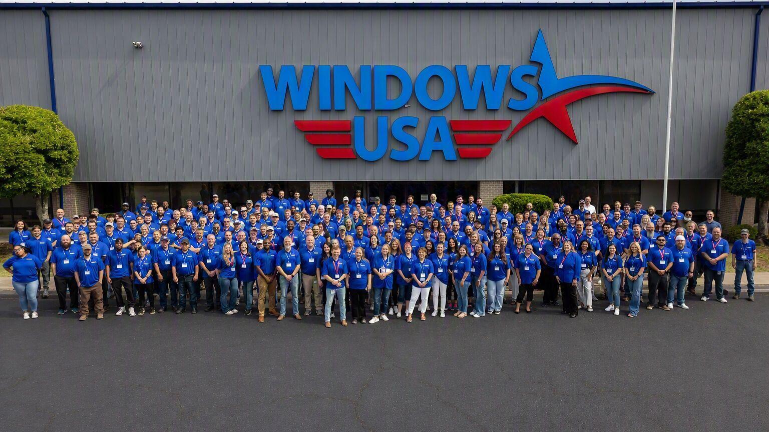 Windows USA employees in front of their new factory and Arkansas headquarters after the completion of the ribbon-cutting event. The company manufactures and sells installed custom vinyl replacement windows and doors, proudly serving homeowners across 15...