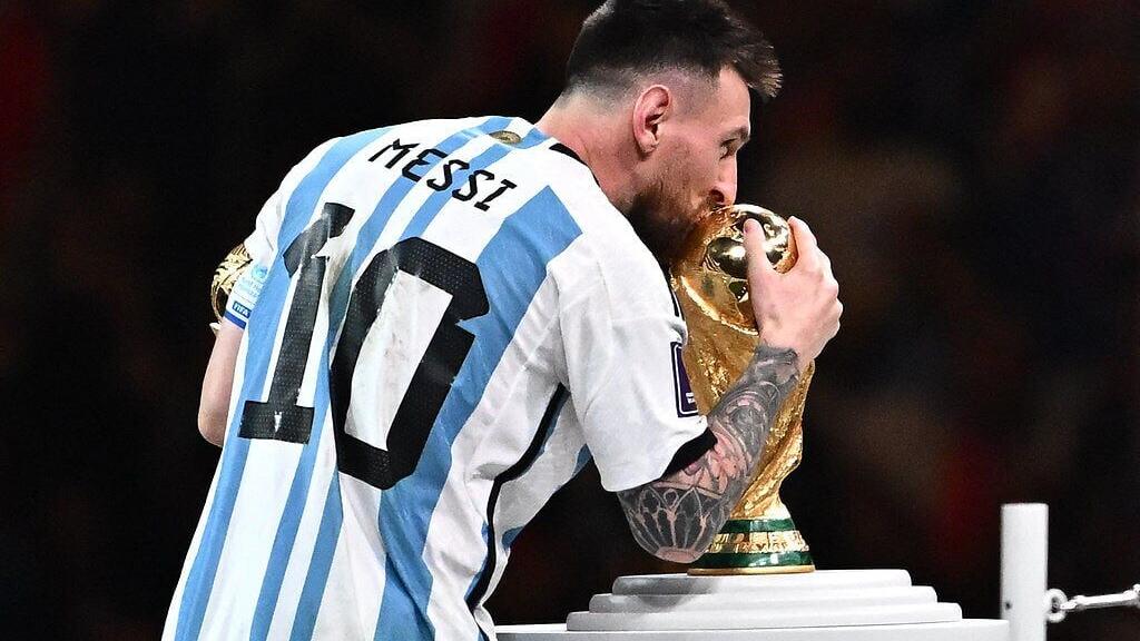 Messi kissing the World Cup trophy in 2022 - can he do it again in 2026?