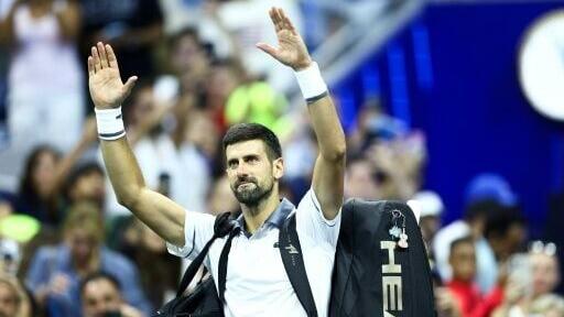 Novak Djokovic waves to fans after falling in the first round of the US Open