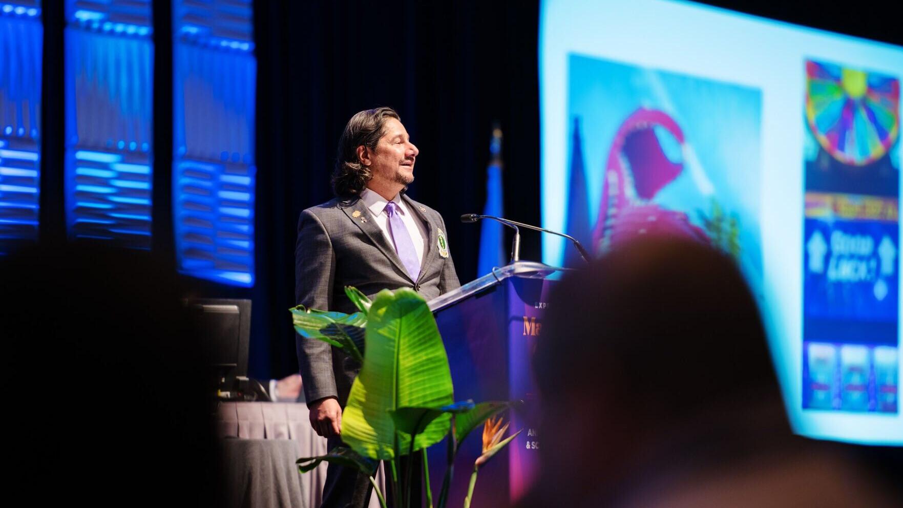 Gautam Desai, DO, FACOFP dist., speaks and presents awards at the ACOFP Annual Convention in Orlando, Florida, celebrating excellence and leadership in osteopathic family medicine.