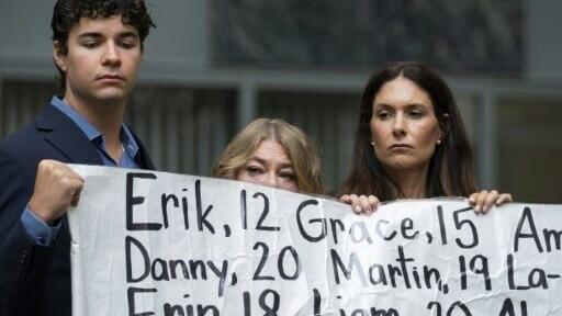 Outside court, activists held a banner with the names of nearly 400 young people whose deaths were allegedly connected to their social media use