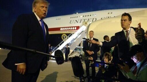 US President Donald Trump talks with the media before boarding Air Force One at Los Angeles International Airport on August 4, 2026 in Los Angeles, California