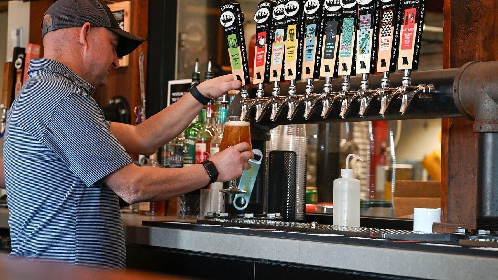 Mark Alexiou pours a glass of Snapper (copy)