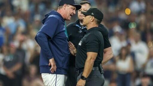 Seattle Mariners manager Dan Wilson, at left arguing with umpires before being ejected, was issued a one-game suspension by Major League Baseball while Seattle pitcher Gabe Speier was handed a three-game ban