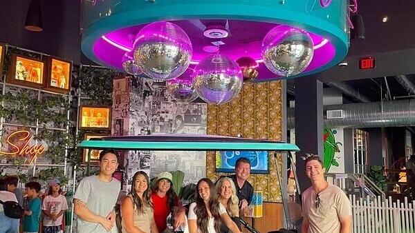 Ultimate Staffing coworkers in Irvine, CA recharging together at a local miniature golf spot.