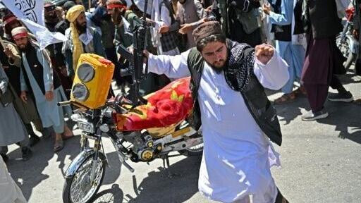 Some Afghans danced in the streets of Kabul as they celebrated the Taliban government's five-year rule