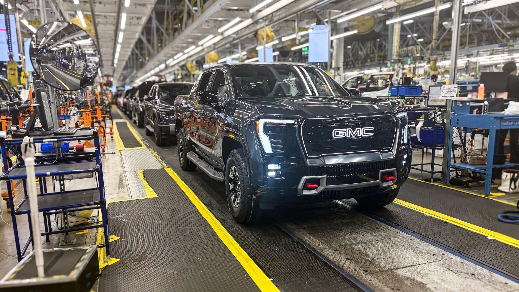 A GMC Sierra EV with battery cells made from recycled materials rolls off the line at GM’s Factory ZERO assembly facility.