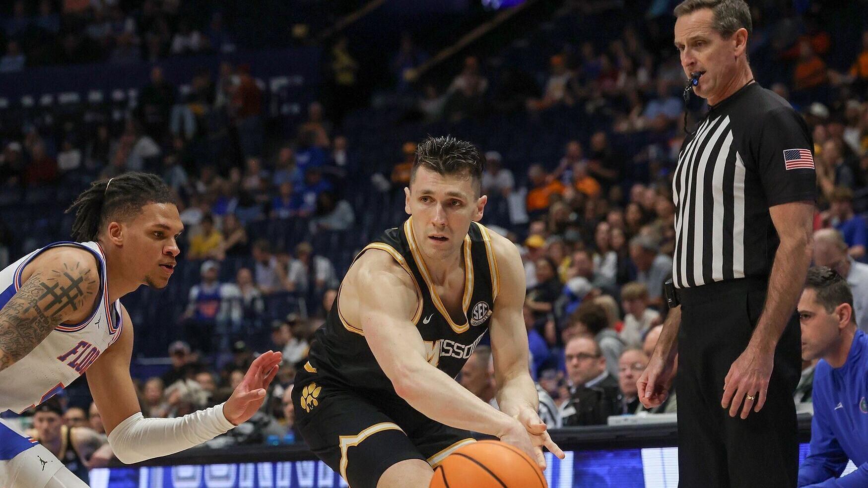 Caleb Grill dribbles down the court (copy) (copy)