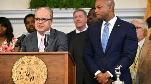 Maryland Jockey Club president Bill Knauf, left, announced the 2027 Preakness will be raced eight days later than usual on May 23 to entice more Kentucky Derby horses into the field while Maryland Governor Wes Moore, right, listens in Annapolis