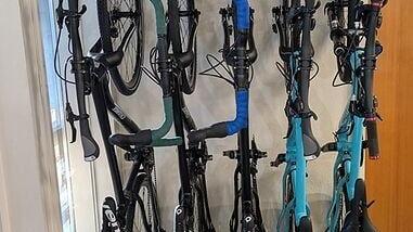 Five bikes in a four-foot space, seconds per bike, with no tools.