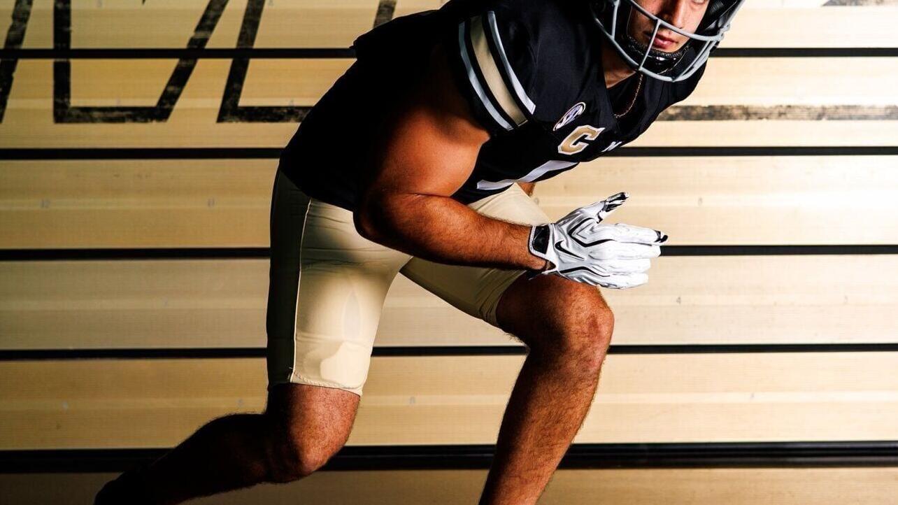 Linebacker Nick Rodriguez models Mizzou's throwback uniforms