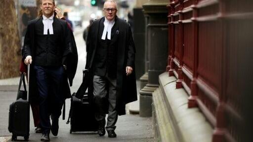 Brendan Kissane (R), Victoria's Director of Public Prosecutions, arrives at the Supreme Court of Victoria in Melbourne on August 19, 2026