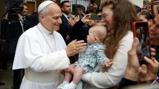 Parents arrived with pushchairs and held children on their shoulders as crowds hoped to catch a glimpse of the pontiff