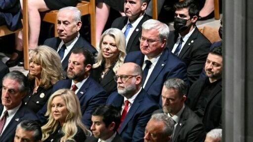 Israli Prime Minister Benjamin Netanyahu (upper L) and Ukrainian President Volodymyr Zelensky (R) attend the funeral service for US Senator Lindsey Graham at the Washington National Cathedral in Washington, DC