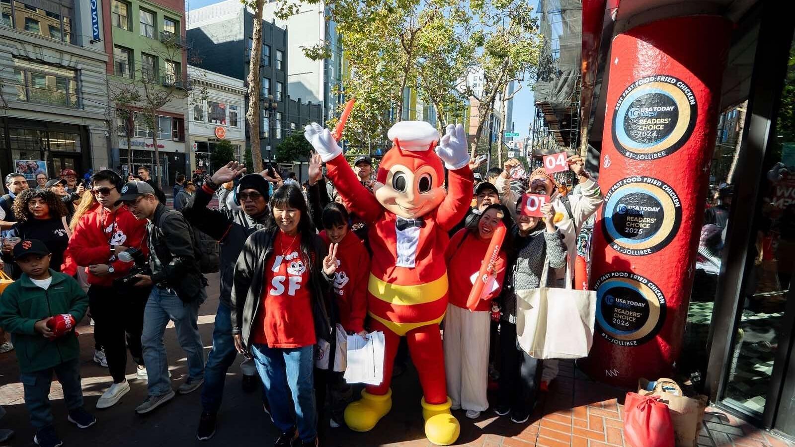 The Jollibee mascot poses with excited customers outside the new downtown San Francisco restaurant at 934 Market St. on Friday, July 31, 2026. Jollibee was recently named America’s “best fast-food fried chicken” by USA Today for the third consecutive ye...