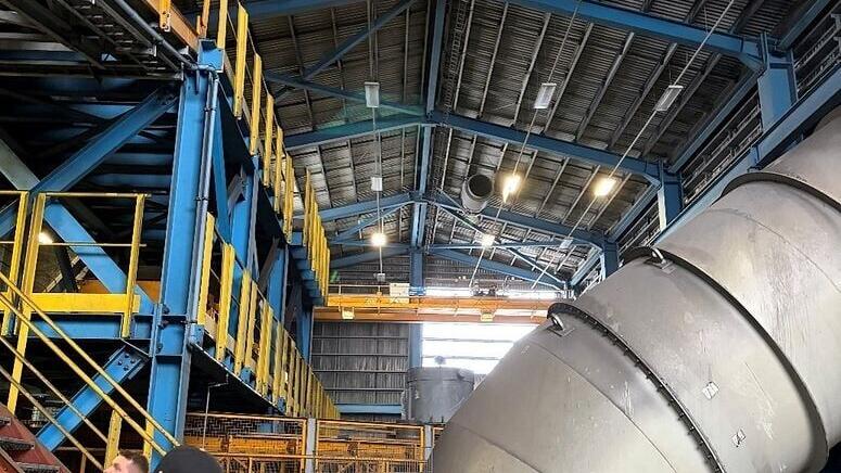 Interior of the former furnace building at Helguvík, showing large scale exhaust ducting and structural steelwork that could be repurposed as part of a modern, low impact processing facility concept. Photo from Greenland Mines Ltd site visit at Helguvik.