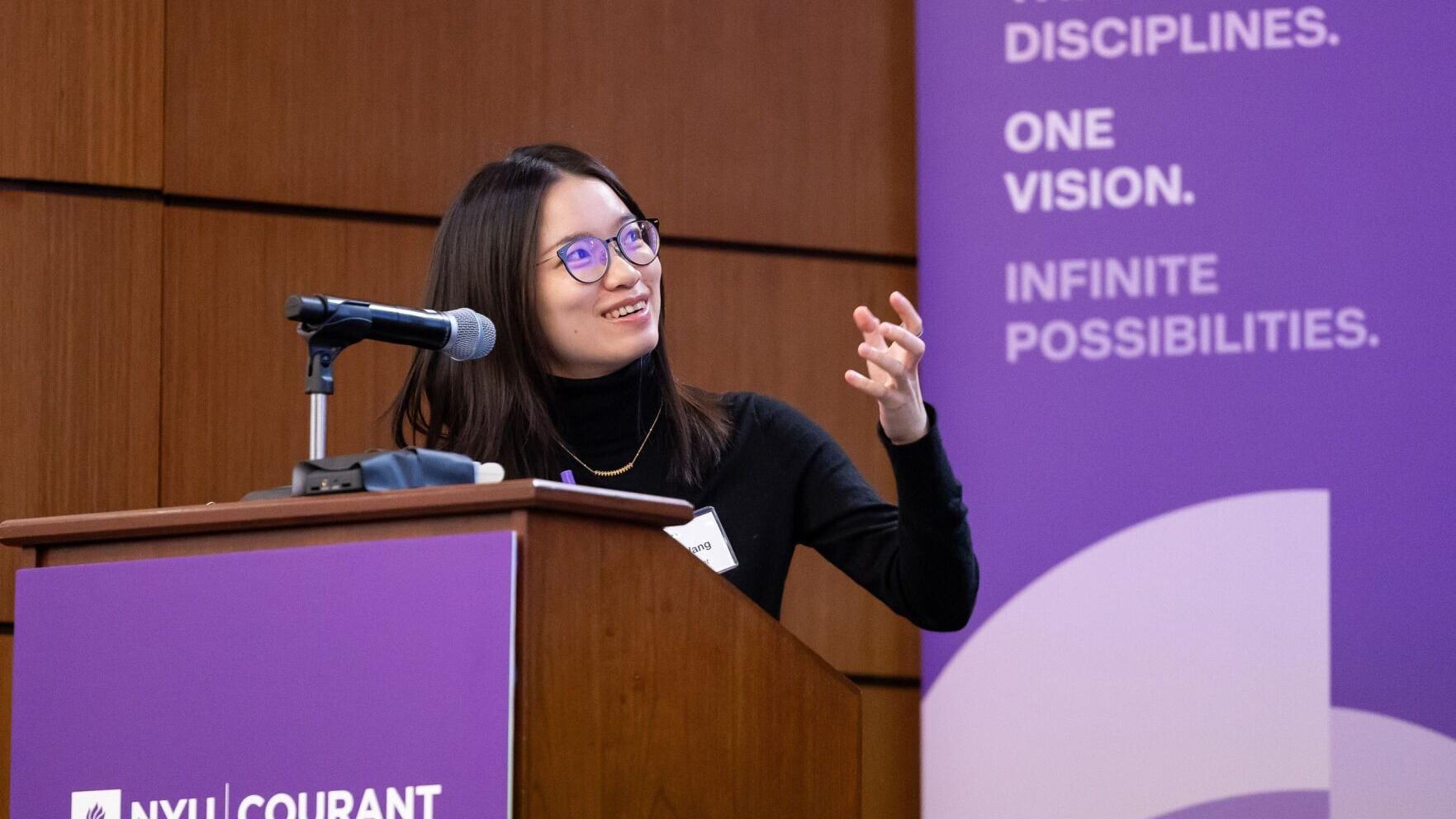 NYU Professor Hong Wang at a 2026 symposium at NYU. © Slezak: Courtesy of NYU Photo Bureau