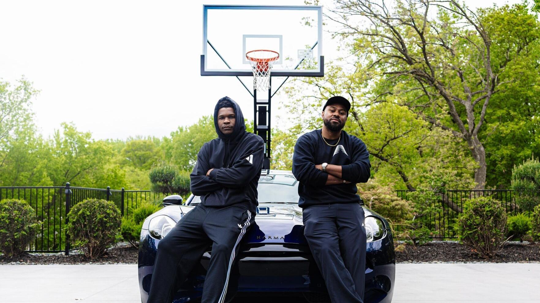 Karma Nexus members Anthony Edwards (Left) of the Minnesota Timberwolves and business manager Justin Holland (Right) with the Karma Revero sport sedan. Photo Credit: Three Fifths Media
