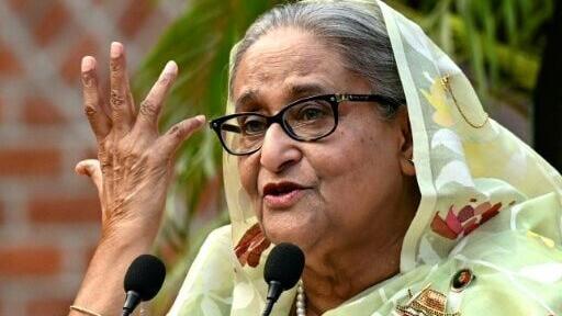 (FILES) Bangladesh's then Prime Minister Sheikh Hasina gestures while speaking to the media, a day after she won the 12th parliamentary elections, in Dhaka on January 8, 2024.