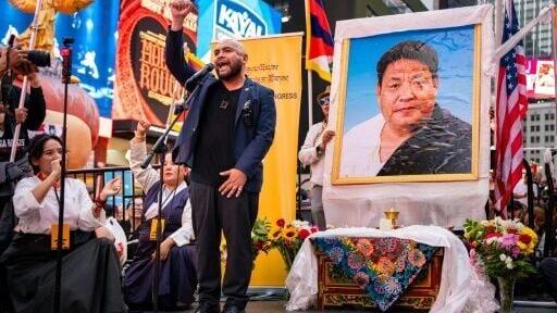 Lobga Rangzen, pictured on the right at a vigil after his death, had recorded a farewell message calling on Tibetans living in exile to take action for the region's independence