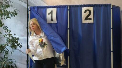 A woman votes in the eastern Ukrainian town of Donetsk, under Russian control