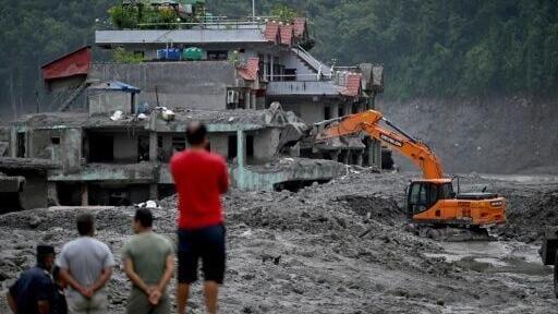 Nepal's government says more than 100 workers may still be trapped alive inside multiple tunnels after devastating floods