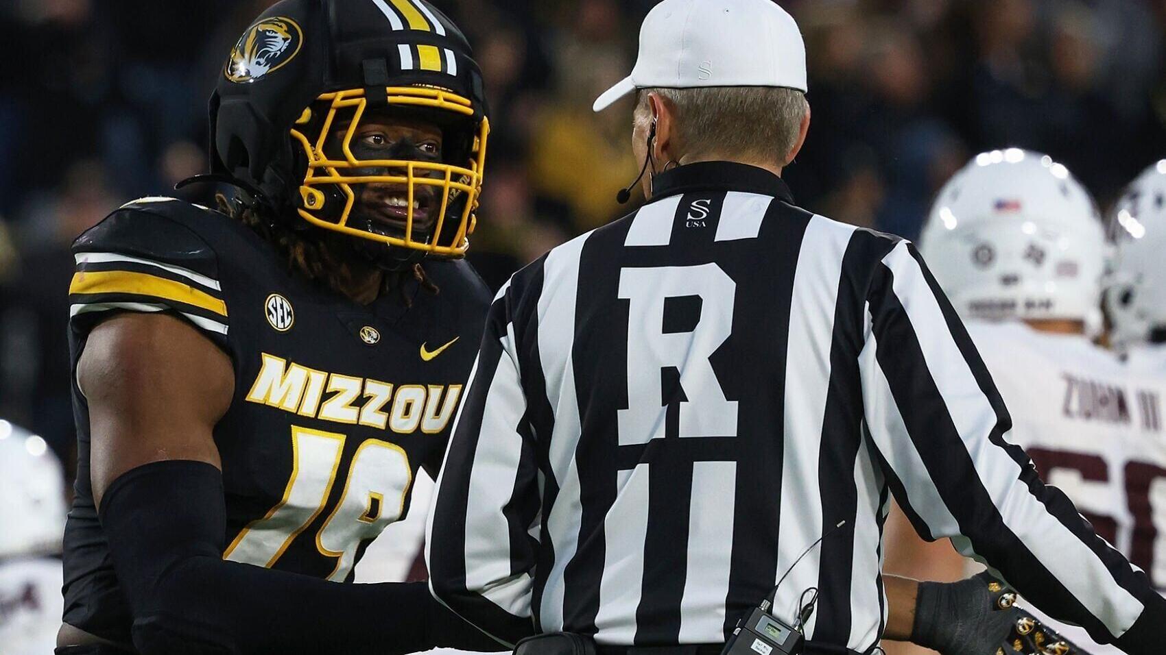 Missouri defensive end Darris Smith (19) protests a call with an official (copy)
