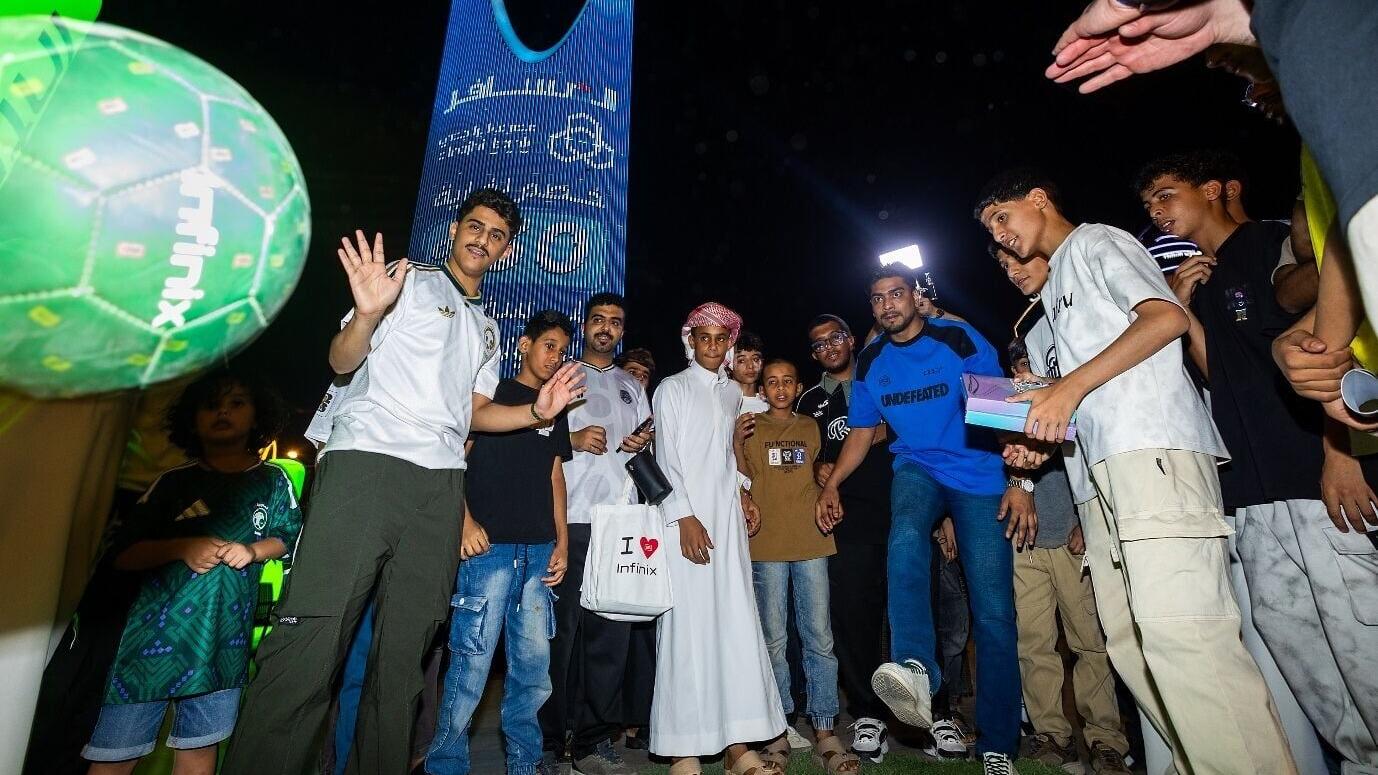Football fans participate in football challenges at an Infinix World Cup watch party in Saudi Arabia.