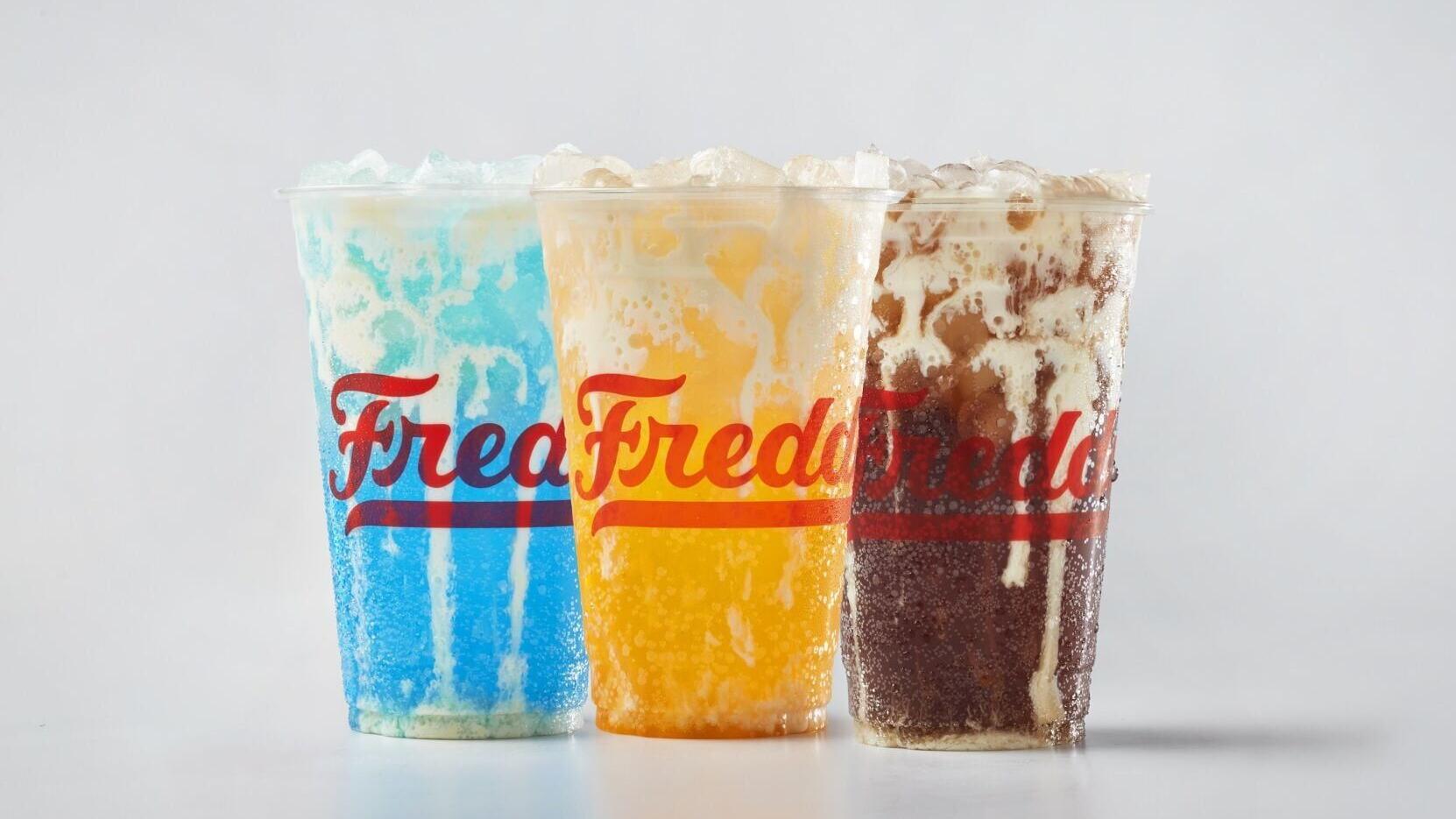 Freddy's new lineup of premium beverages, Freddy's Bevies, is now available. Pictured from L to R: Blue Rizzberry Cream Soda, Golden Hour Orange Custard Cream Soda, Coco Loco Custard Cream Soda.