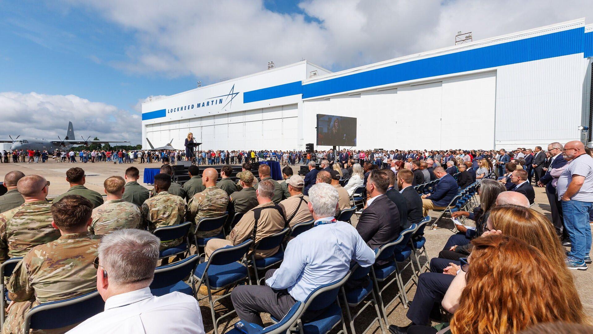 Trish Pagan, vice president of Lockheed Martin's Air Mobility and Maritime Missions and general manager Marietta site, addresses guests celebrating the 75th anniversary of Lockheed Martin's Marietta manufacturing facility. In the background, Lockheed Ma...