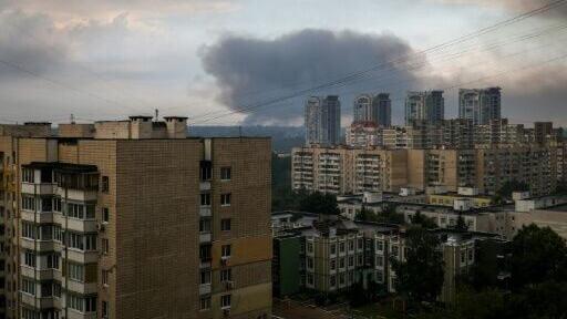 Smoke over the Ukrainian capital at sunrise