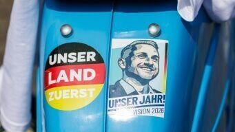 A Simson moped with an AfD sticker showing Ulrich Siegmund and the slogan 'Our Country First'