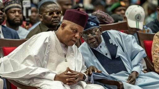 Nigerian President Bola Tinubu (R), seeking re-election, is widely considered the country's shrewdest political dealmaker