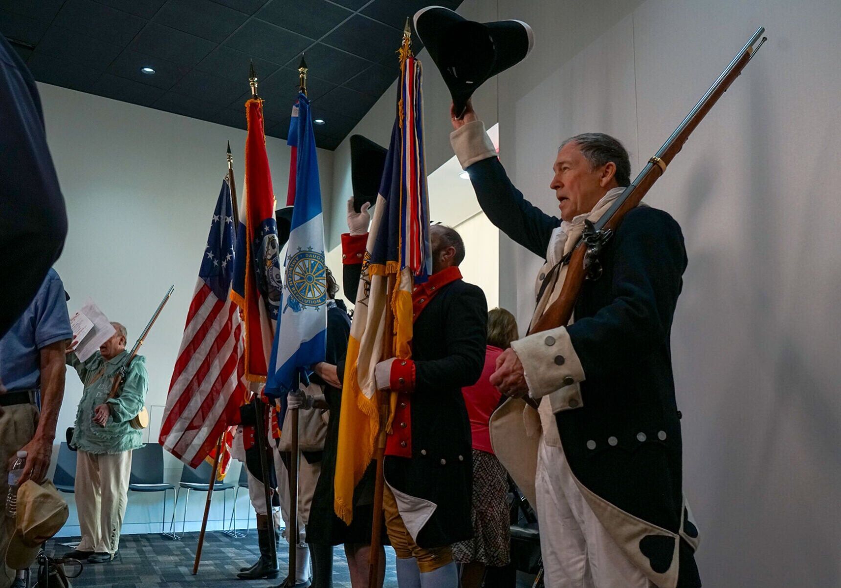 Mitchell Moore, right, cheers for America