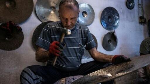 'Not a single blow is random,' he explains as a trio of craftsmen land expert strikes