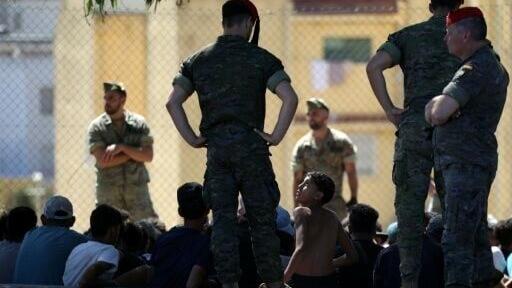 Spanish soldiers have detained some of the migrants who stayed on in Ceuta
