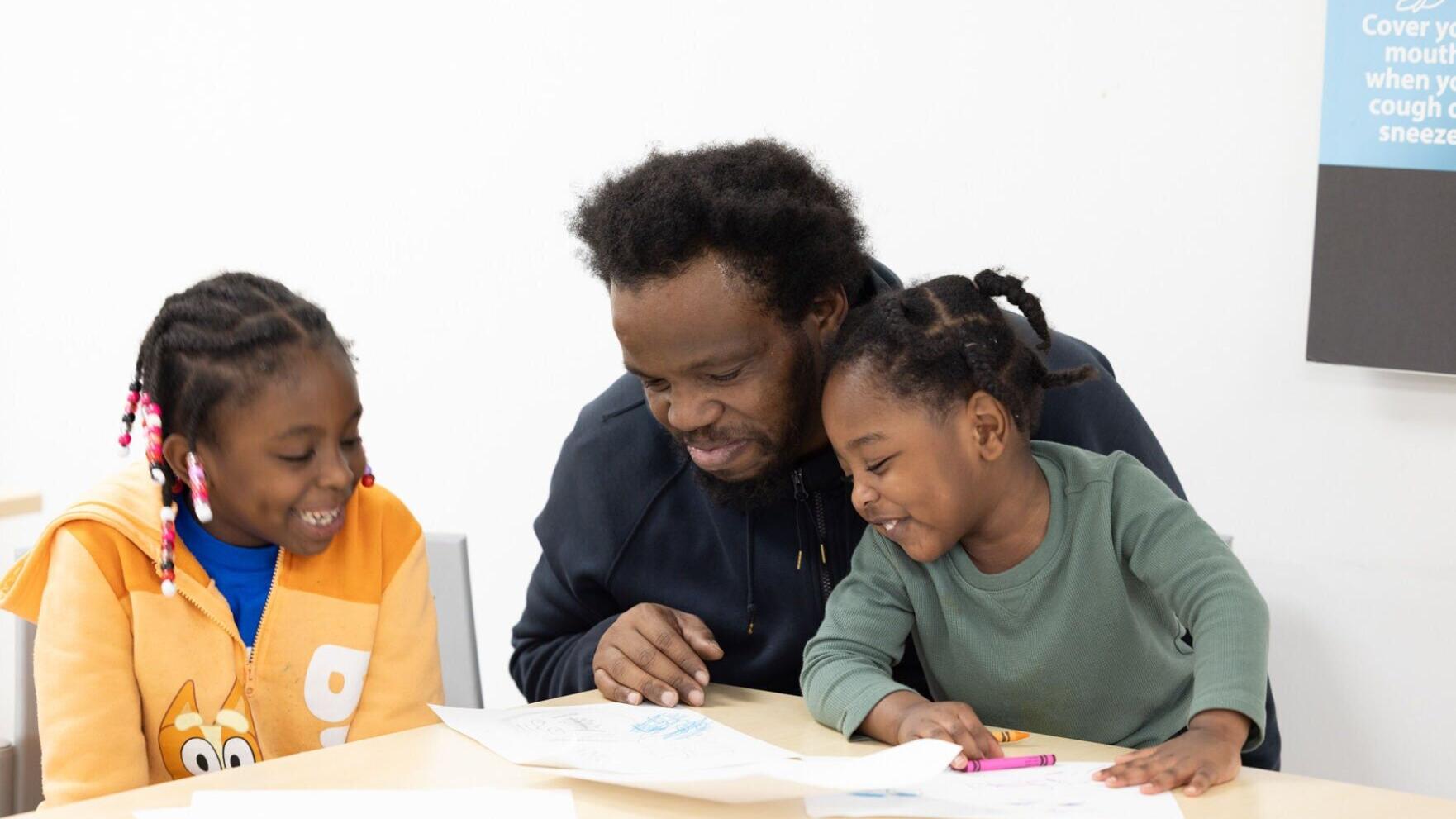 HERO Dad and children enjoy playtime.